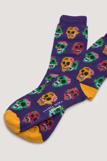 Pamela Mann Gruesome Skull Socks - Dark purple cotton crew length socks with an all over scary skulls pattern in green, yellow, pink, black and white, yellow heel and toe, perfect for halloween.