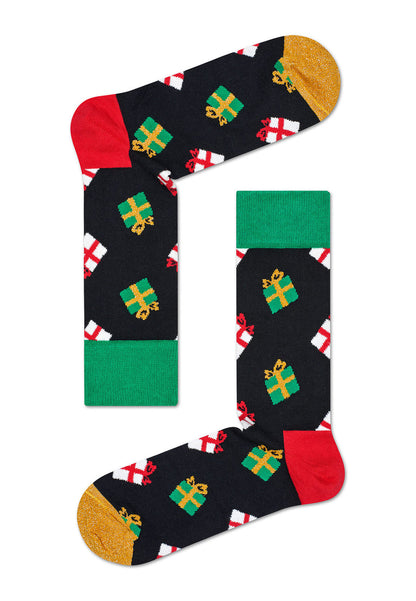 Happy Socks XMAS08-7001 Xmas Box Set - Christmas gift box with three pairs of socks, one pair is black with presents pattern in green, red, white and gold, gold toe, green cuff and red heel. Another is rust orange with speckled confetti style pattern in black, green and gold with black cuff, heel and toe and the other style is rust with a black wavy diagonal pattern and cuff and red toe.