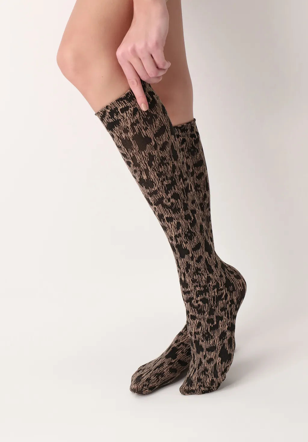 OroblÌ_ Savannah Sock - Soft beige fashion knee-high socks with a woven black leopard print style pattern.